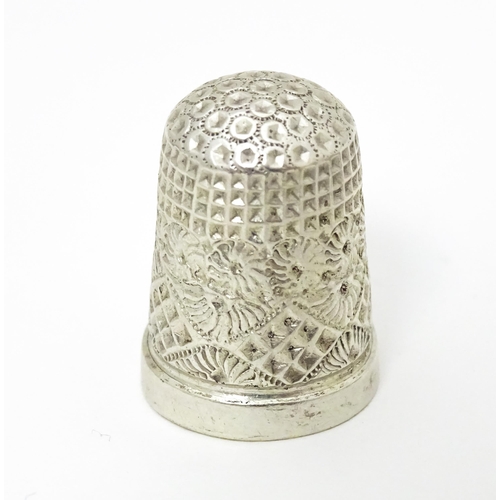 439 - Three thimbles to include two silver examples, one hallmarked Chester 1896 maker Henry Griffith & So... 