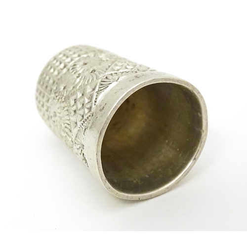 439 - Three thimbles to include two silver examples, one hallmarked Chester 1896 maker Henry Griffith & So... 