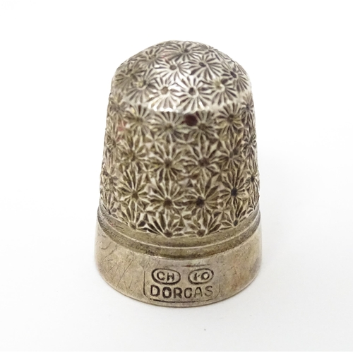 439 - Three thimbles to include two silver examples, one hallmarked Chester 1896 maker Henry Griffith & So... 