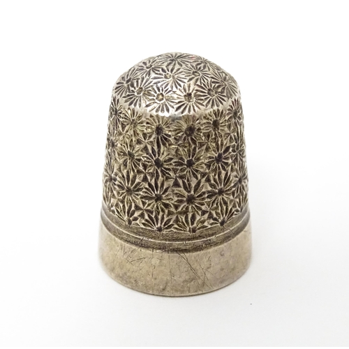 439 - Three thimbles to include two silver examples, one hallmarked Chester 1896 maker Henry Griffith & So... 