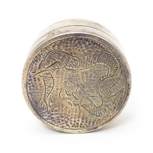 452 - A silver pill box with engraved Oriental dragon decoration to lid, marked sterling, maker W.K. Appro... 