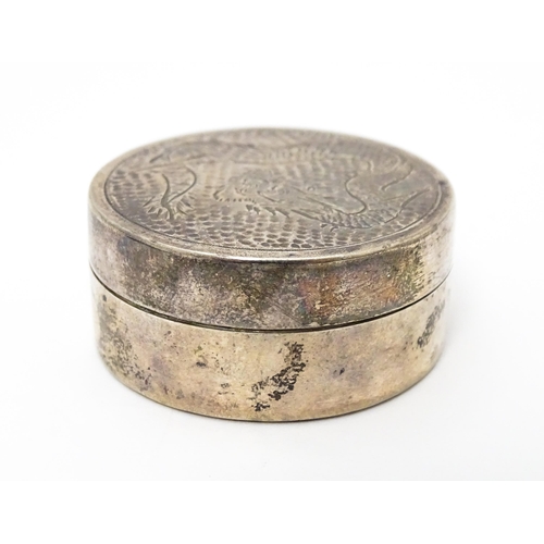 452 - A silver pill box with engraved Oriental dragon decoration to lid, marked sterling, maker W.K. Appro... 