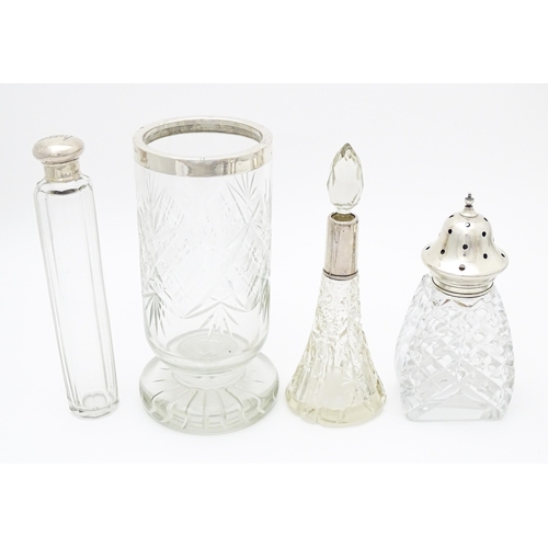 453 - Assorted cut glass items with silver mounts, to include a caster hallmarked 1939, a vase hallmarked ... 