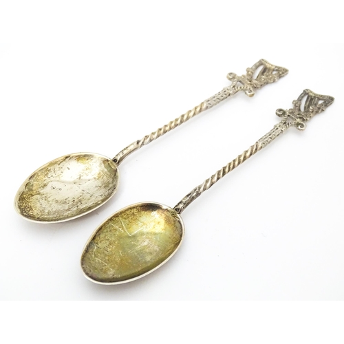 455 - A pair of Victorian silver teaspoons the handles surmounted by harp and shamrock decoration, hallmar... 