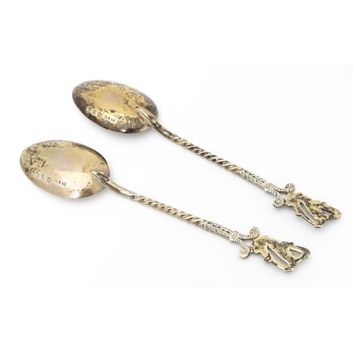 455 - A pair of Victorian silver teaspoons the handles surmounted by harp and shamrock decoration, hallmar... 