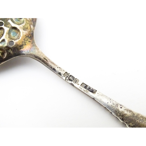 456 - A silver sifter spoon with embossed and pierced detail to bowl, hallmarked Sheffield 1903, maker Wil... 