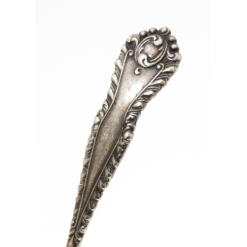 456 - A silver sifter spoon with embossed and pierced detail to bowl, hallmarked Sheffield 1903, maker Wil... 