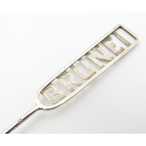 457 - A white metal souvenir fork titled Brunei to handle. Together with a white metal teaspoon also title... 