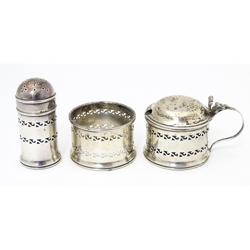 460 - A three piece silver cruet comprising mustard pot, pepper and salt frame, hallmarked Birmingham 1957... 