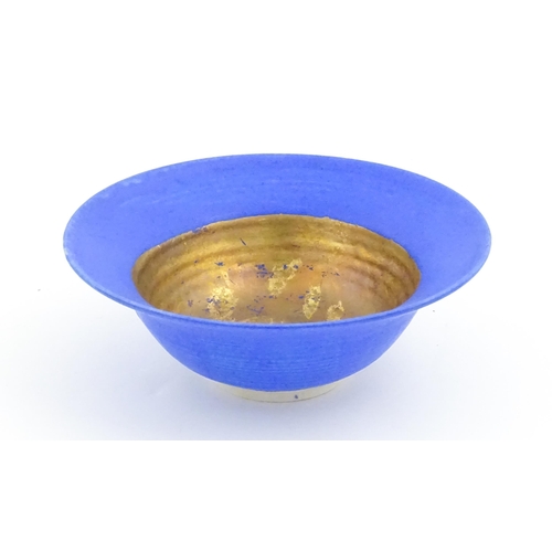 105 - A studio pottery bowl by Mary Rich with cobalt blue and gilt detail. Makers mark to rim of base. App... 