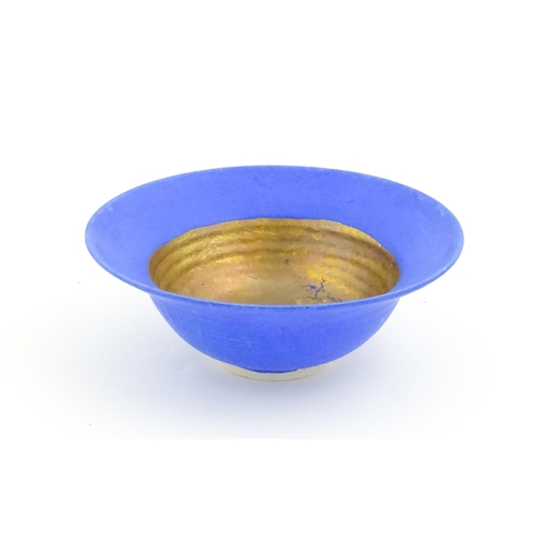 105 - A studio pottery bowl by Mary Rich with cobalt blue and gilt detail. Makers mark to rim of base. App... 