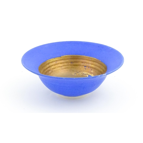 105 - A studio pottery bowl by Mary Rich with cobalt blue and gilt detail. Makers mark to rim of base. App... 