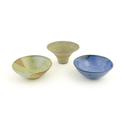 111 - Three studio pottery bowls comprising a bowl with abstract detail signed under Jam, a blue glazed ex... 