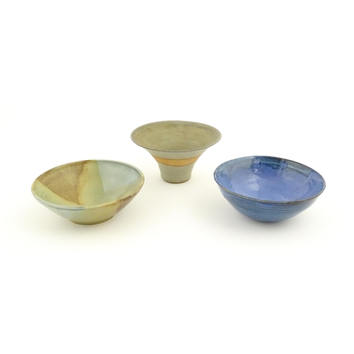 111 - Three studio pottery bowls comprising a bowl with abstract detail signed under Jam, a blue glazed ex... 