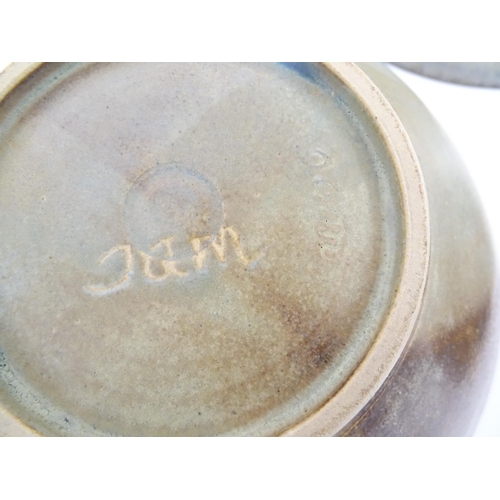 111 - Three studio pottery bowls comprising a bowl with abstract detail signed under Jam, a blue glazed ex... 