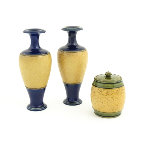 123 - A pair of Royal Doulton Slaters patent stoneware vases with blue glaze and relief banded detail. Mar... 