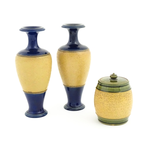 123 - A pair of Royal Doulton Slaters patent stoneware vases with blue glaze and relief banded detail. Mar... 