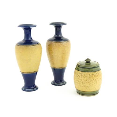 123 - A pair of Royal Doulton Slaters patent stoneware vases with blue glaze and relief banded detail. Mar... 