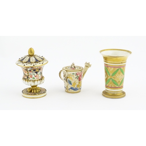 126 - Three items of Derby porcelain comprising a vase with flared rim decorated with banded floral and fo... 