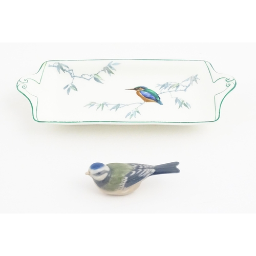 131 - A Royal Copenhagen model of a blue tit. Together with a Royal Doulton dish of oblong dish with hand ... 