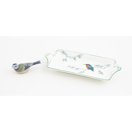 131 - A Royal Copenhagen model of a blue tit. Together with a Royal Doulton dish of oblong dish with hand ... 