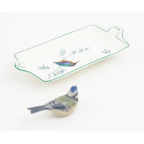 131 - A Royal Copenhagen model of a blue tit. Together with a Royal Doulton dish of oblong dish with hand ... 