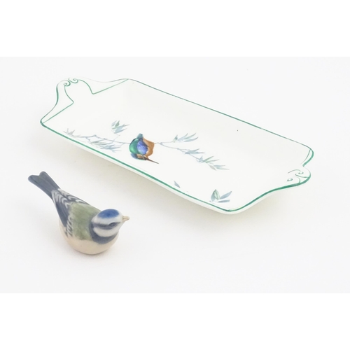 131 - A Royal Copenhagen model of a blue tit. Together with a Royal Doulton dish of oblong dish with hand ... 