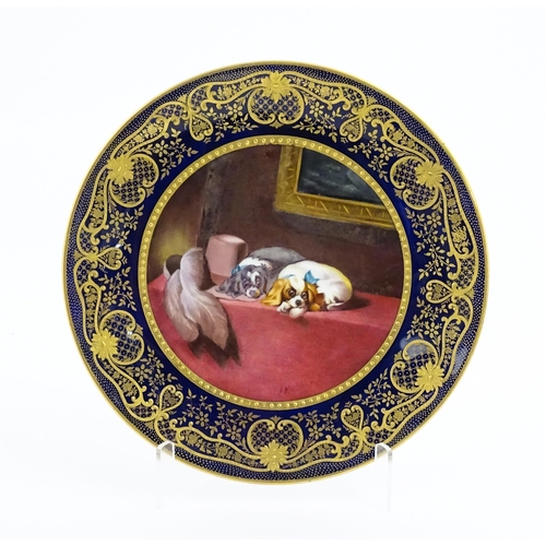 132 - A Paragon plate hand painted by F. Micklewright The Cavalier's Pets after Sir Edwin Landseer. Signed... 