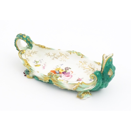 134 - A 19thC Continental dish modelled as a recumbent crocodile / alligator with hand painted floral deta... 