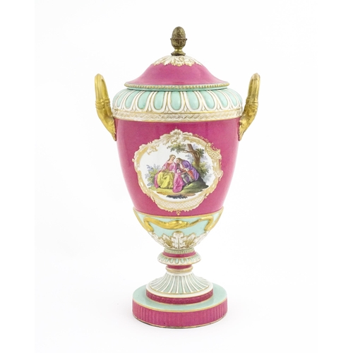 136 - A large KPM pedestal vase and cover of twin handled urn form, the pink ground decorated with vignett... 