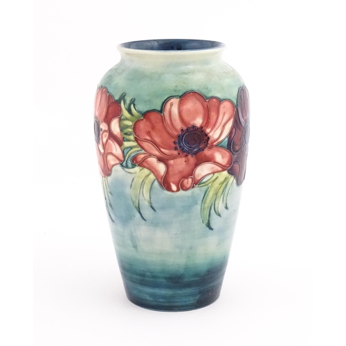 138 - A Moorcroft vase decorated in the Anemone pattern. Marked under. Approx. 10 1/4