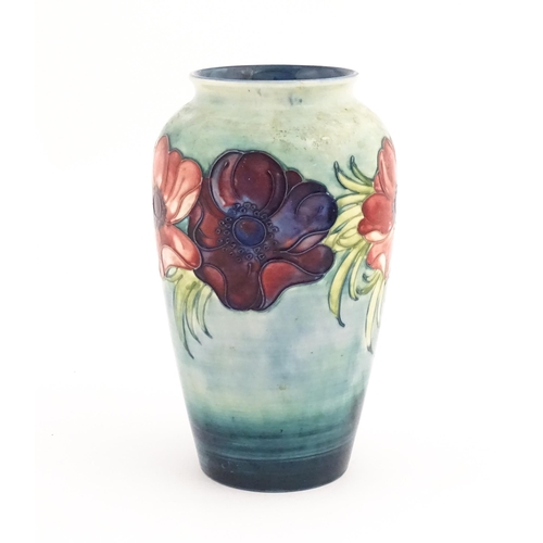 138 - A Moorcroft vase decorated in the Anemone pattern. Marked under. Approx. 10 1/4