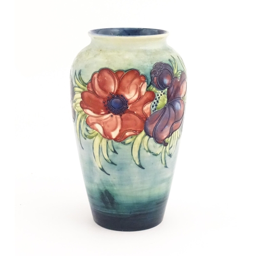 138 - A Moorcroft vase decorated in the Anemone pattern. Marked under. Approx. 10 1/4