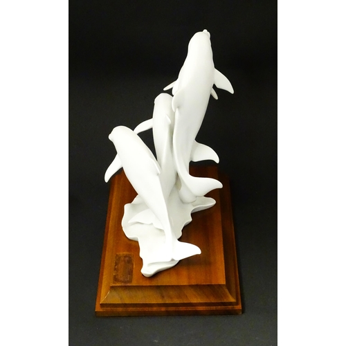 151 - A limited edition Kaiser bisque porcelain group depicting four bottlenose dolphins. Limited edition ... 