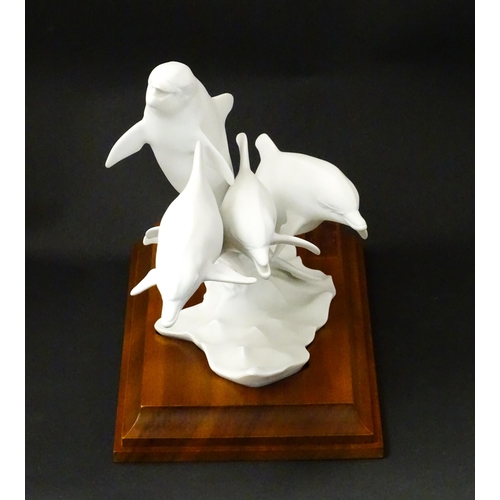 151 - A limited edition Kaiser bisque porcelain group depicting four bottlenose dolphins. Limited edition ... 