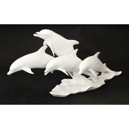 151 - A limited edition Kaiser bisque porcelain group depicting four bottlenose dolphins. Limited edition ... 