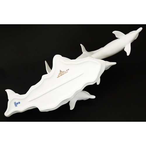 151 - A limited edition Kaiser bisque porcelain group depicting four bottlenose dolphins. Limited edition ... 