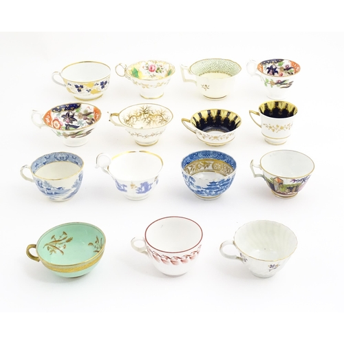 164 - A quantity of assorted tea cups and saucers to include examples by Rockingham, Bloor Derby, etc. Lar... 