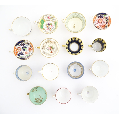 164 - A quantity of assorted tea cups and saucers to include examples by Rockingham, Bloor Derby, etc. Lar... 