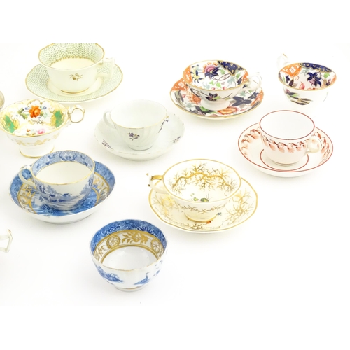 164 - A quantity of assorted tea cups and saucers to include examples by Rockingham, Bloor Derby, etc. Lar... 