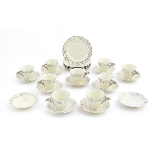 168 - A quantity of Art Deco style tea wares with banded detail comprising plates, cups and saucers. Cups ... 