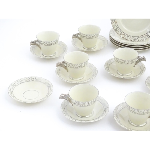 168 - A quantity of Art Deco style tea wares with banded detail comprising plates, cups and saucers. Cups ... 