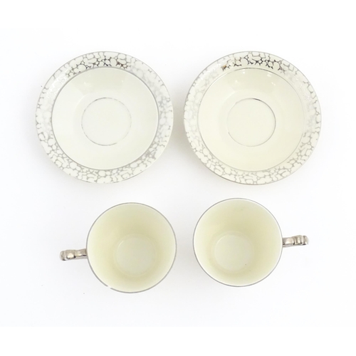 168 - A quantity of Art Deco style tea wares with banded detail comprising plates, cups and saucers. Cups ... 