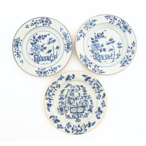 60 - Two Chinese blue and white plates decorated with a peony flower in a garden, with floral border. Bot... 