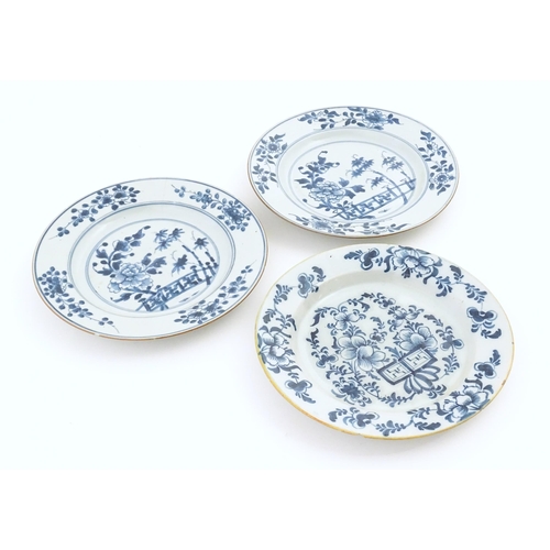 60 - Two Chinese blue and white plates decorated with a peony flower in a garden, with floral border. Bot... 