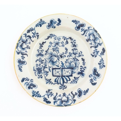 60 - Two Chinese blue and white plates decorated with a peony flower in a garden, with floral border. Bot... 