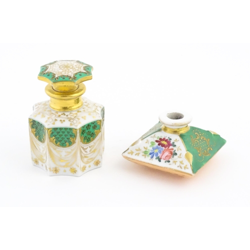 66 - A French porcelain scent / perfume bottle of octagonal form with gilt foliate decoration. Marked und... 