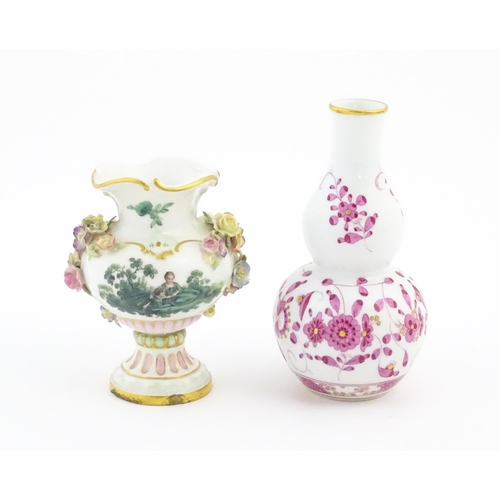 67 - Two small Continental vases comprising a double gourd vase with scrolling floral and foliate detail,... 