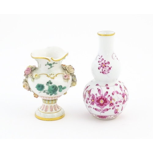 67 - Two small Continental vases comprising a double gourd vase with scrolling floral and foliate detail,... 