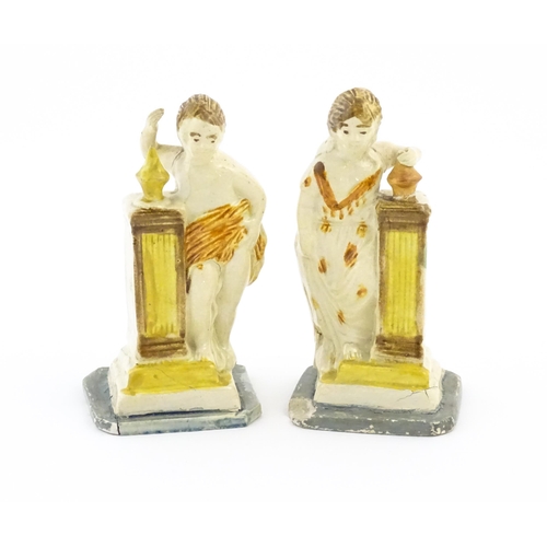 70 - A pair of English creamware pottery Classical figures with column detail. Approx. 4 3/4